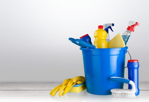 Cleaner following safe working practices during a carpet cleaning job